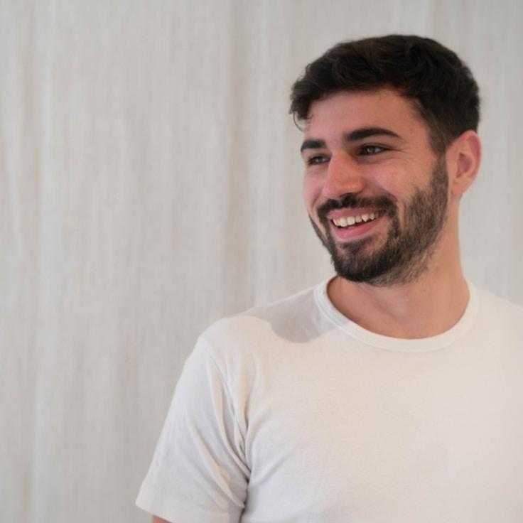 Alex Rivera, Lead Design Curator at Universal Process Matrix, reviewing corporate floral arrangements